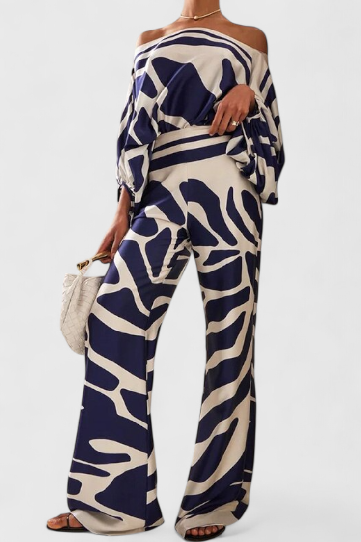 Sara-Alícia | Conjunto de Dos Piezas con Hombros Descubiertos y Pantalones Amplios Estampados