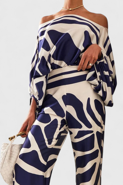 Sara-Alícia | Conjunto de Dos Piezas con Hombros Descubiertos y Pantalones Amplios Estampados